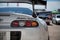 Closeup shot of the rear of a white fourth-generation Toyota Supra with a blur background