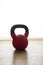 Closeup shot of a red kettlebell for doing exercises at home