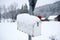 Closeup shot of a red mailbox covered in snow