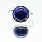 Closeup shot of a ring made of round Lapis gemstone