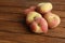 Closeup shot of ripe Paraguayan peach on a wooden surface