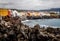 Closeup shot of a rocky beach and buildings of Puerto de la Cruz in the Canary Islands, Spain