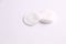 Closeup shot of the round cotton discs on a white background