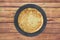 Closeup shot of a round omelet on a wooden table