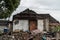 Closeup shot of a ruined rural house with damaged roof and walls after a flood