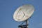 Closeup shot of a satellite dish on a blue sky background