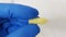 Closeup shot of a scientist\\\'s or researcher\\\'s hand holding suppositories in the pharmacy laboratory