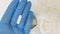 Closeup shot of a scientist\\\'s or researcher\\\'s hand holding suppositories in the pharmacy laboratory
