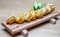 Closeup shot of a selection of vegetable rolls on a wooden platter.