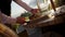 Closeup shot of a server placing a gourmet dish on an outdoor restaurant table