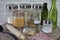 Closeup shot of a set of glass cylindrical containers with cereals, a spoon and a rolling pin