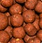 Closeup shot of several boilies used for carp fishing