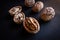 Closeup shot of several full and half walnuts placed in row on an isolated background