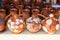 Closeup shot of several pitchers next to each other on a white surface