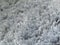 Closeup shot of shaggy light gray carpet texture details