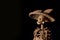 Closeup shot of a skeleton figurine prepared for the day of the dead on a dark background