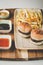 Closeup shot of small hamburgers, fries, and sauces