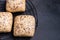 Closeup shot of small loaves of breads with sunflower, sesame and poppy seeds