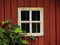 Closeup shot of a small window detail of a typical Swedish wood house