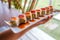 Closeup shot of someone holding a tray of different types of sushi