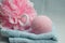 Closeup shot of a sponge and soap ball on top of a towel