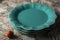 Closeup shot of a stack of green plates on the table