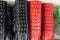 Closeup shot of stacks of colorful flowerpots on a shelf