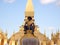 Closeup shot of the statue of King Sethathirath in Pha That Luang stupa in Vientiane, Laos