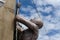 Closeup shot of a statue of a person climbing a rope