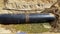 Closeup shot of steel casing pipe on the ground