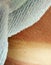 Closeup shot of a sunburnt skin with a white towel