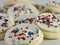 Closeup shot of sweet vanilla iced sugar cookies with sprinkles