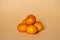 Closeup shot of tangerines isolated on a peachy background