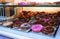 Closeup shot of tasty doughnuts on the bakery shelves