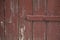 Closeup shot of a textured colored old door. Rural fence texture background