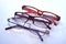 Closeup shot of three reading glasses isolated on a white background