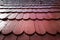 Closeup shot of a tiled wooden red roof - perfect for construction backgrounds