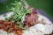 Closeup shot of a tortilla with meat, beans, greens and sour cream