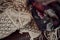 Closeup shot of traditional pieces of fabric on a leather couch