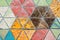 Closeup shot of triangular colorful textured tiles
