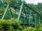 A closeup shot of Truss bridge taken from front. This bridge is painted green for protection against corrosion