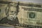 Closeup shot of twenty dollars  Andrew Jackson on it wearing a face mask-coronavirus concept