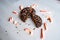 Closeup shot of two halves of a chocolate Christmas candy cane peppermint cookie