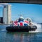 Closeup shot of a Union Jack hovercraft in Southampton, Hampshire and a white building