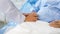 Closeup shot of unrecognizable unknown doctor in white lab coat with stethoscope hand holding comforting supporting old senior