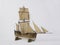 Closeup shot of a vintage figurine of a ship isolated on a white background