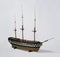 Closeup shot of a vintage figurine of a ship isolated on a white background