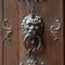 Closeup shot of a vintage metal ring knock on a wooden door