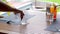 A closeup shot of a waiter pouring fresh drinking water into a glass