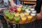 Closeup shot of a waiter serving colorful drinks